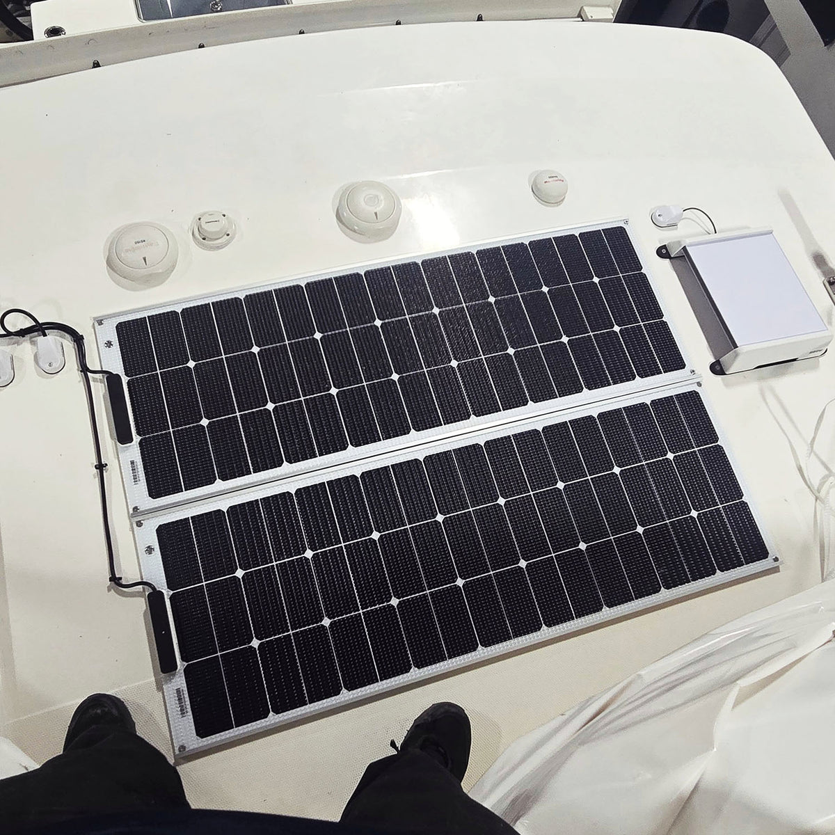 Two 100 watt walkable solar panels installed on  a Boston Whaler