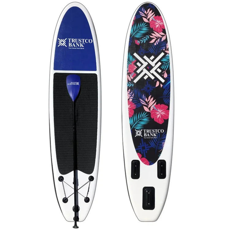 Custom branded inflatable SUP with nose and bottom graphics, including matching paddle
